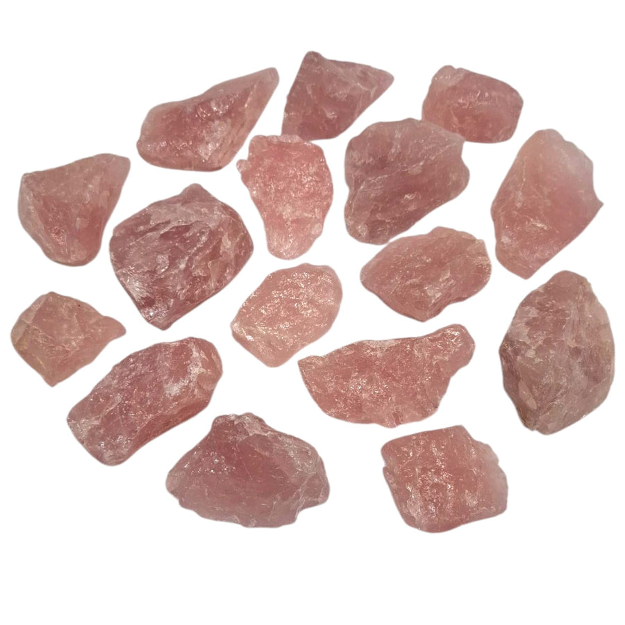 Large 1kg Rose Quartz chunks with soft pink hues, natural raw texture, and semi-translucent glow, displayed under natural light to show its calming energy and gentle colour variations.
