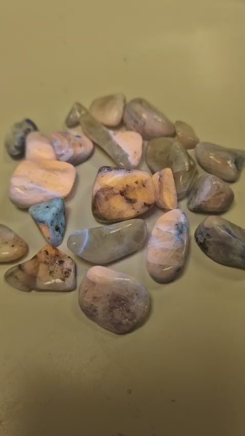 GeoFossils Afghanite Tumble Stone – vibrant blue mineral with natural white veining, polished to a smooth finish; displays a striking UV fluorescence under ultraviolet light.