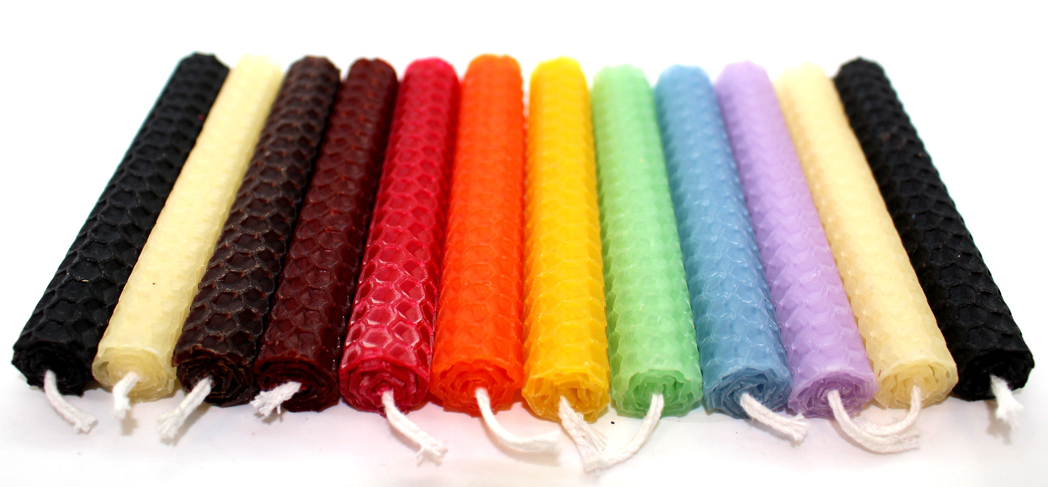 12 Assorted Beeswax Hand Rolled Candles that are black, orange, purple, burgundy, yellow, green, blue and red
