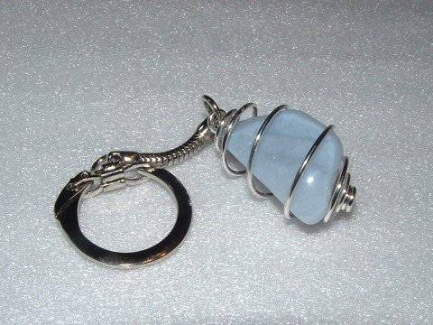Silver 2 part keyring, light blue, angular, shiny and smooth stone in a silver spiral keyring