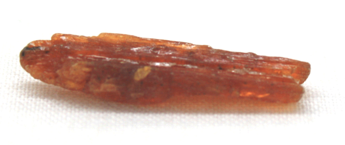 Orange minerals with brown streaks, long rigid shaped