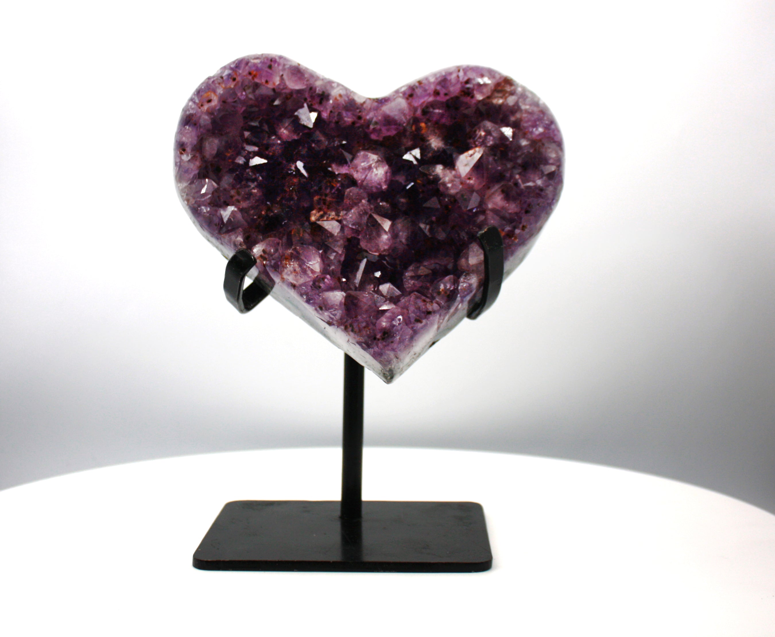 Heart shaped purple crystal with rigid sparkly crystals with black stand