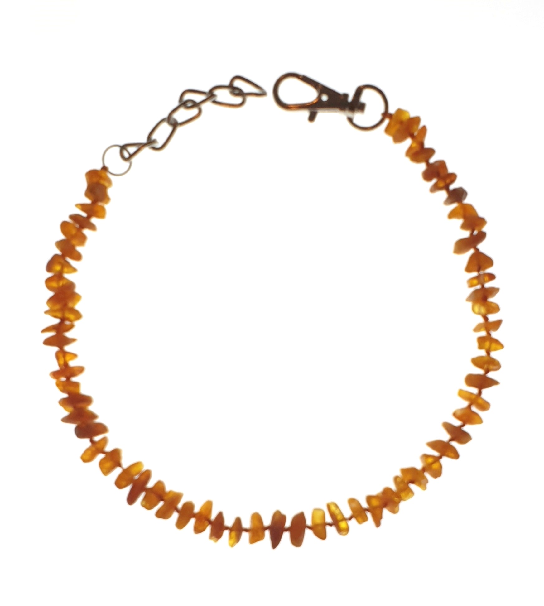 Orange smooth chips on a wire as a collar with clip