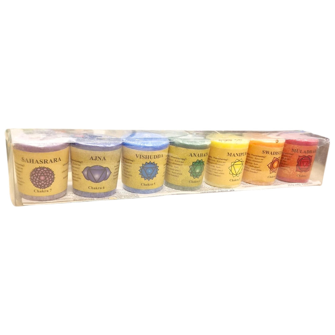 Set of seven chakra candles in different colours and scents for spiritual balance, meditation, and energy healing