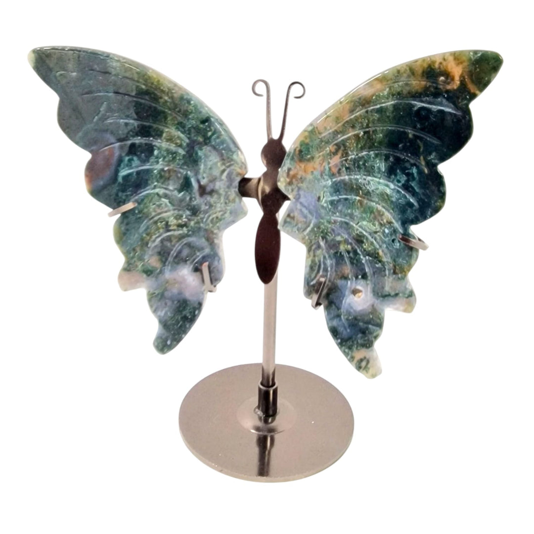 GeoFossils Green Moss Agate butterfly wings carved and displayed on a stand, with natural moss-like inclusions, featured as a one-off in a live crystal auction.