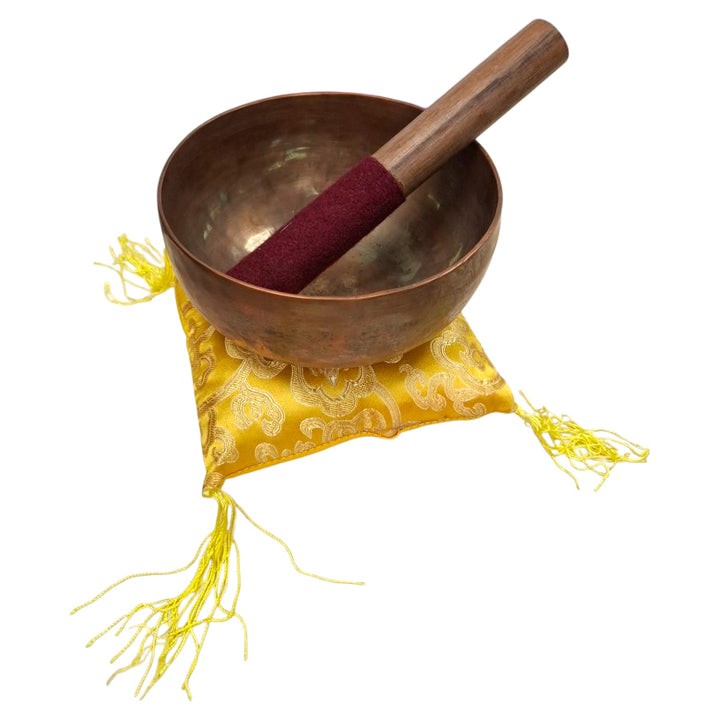 Hand-hammered metal singing bowl with striker and cushion, ideal for sound healing, meditation, and ritual energy work