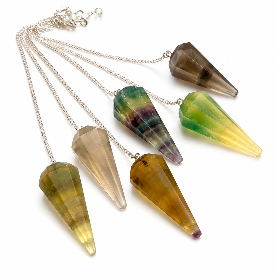 Five faceted crystal cone pendants on silver chains, displayed against a clean white background. The crystals show various natural color patterns including smoky brown, green-yellow, and amber tones.