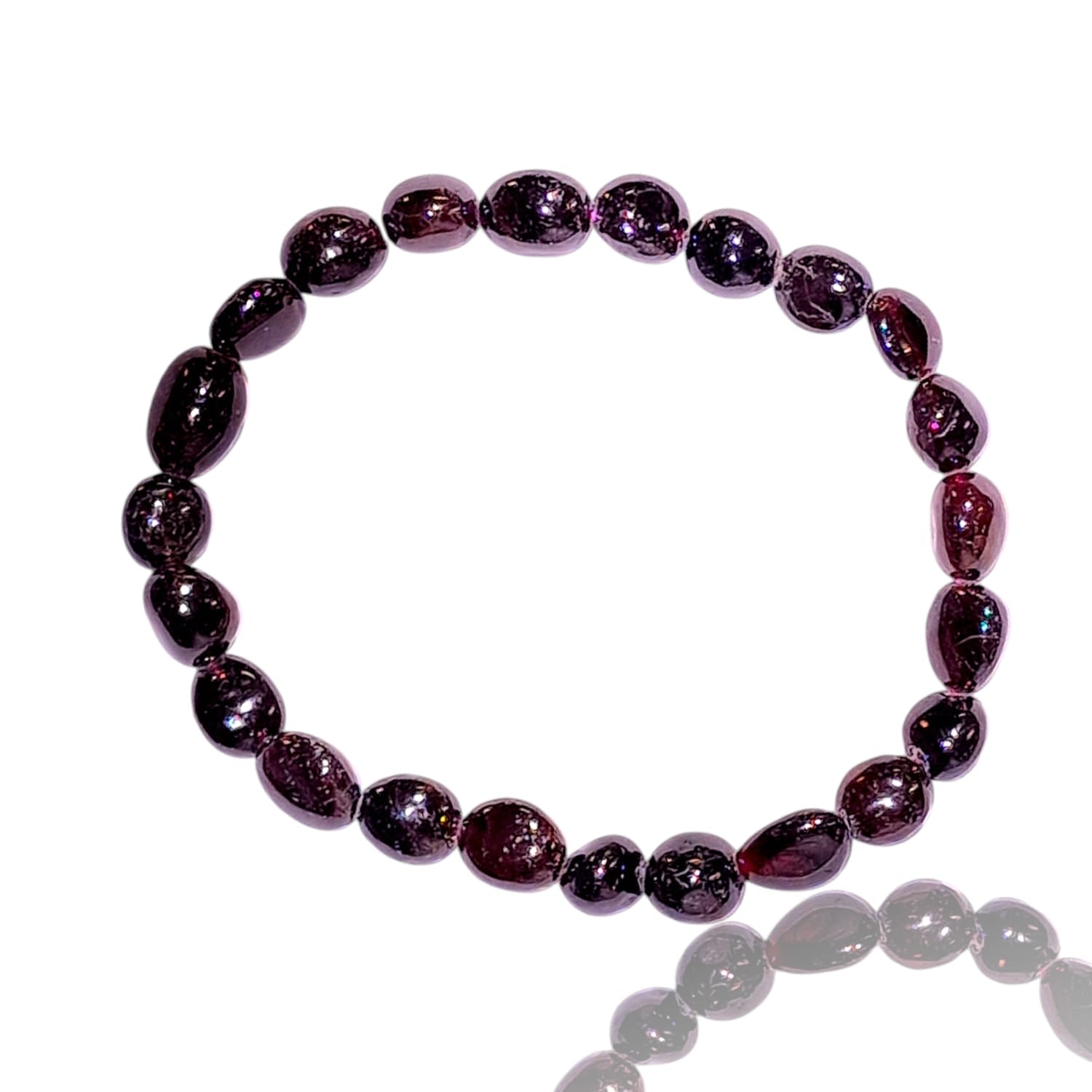 GeoFossils stretch nugget bracelet made from deep red garnet stones, showcasing rich, dark crimson hues with a subtle glossy finish. The stones are irregularly shaped and polished, highlighting their natural luster and depth. The elastic band provides a comfortable, adjustable fit, and the intense, warm tones of the red garnet create a bold, passionate aesthetic that reflects strength and vitality.