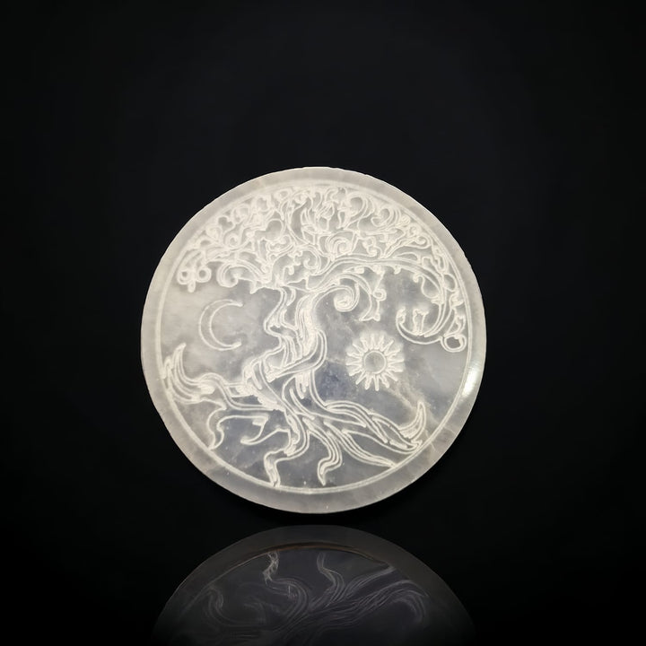 Selenite Tree of Life Charging Disc by GeoFossils – 10cm round, smooth, white selenite disc with engraved Tree of Life, ideal for crystal charging and spiritual cleansing.