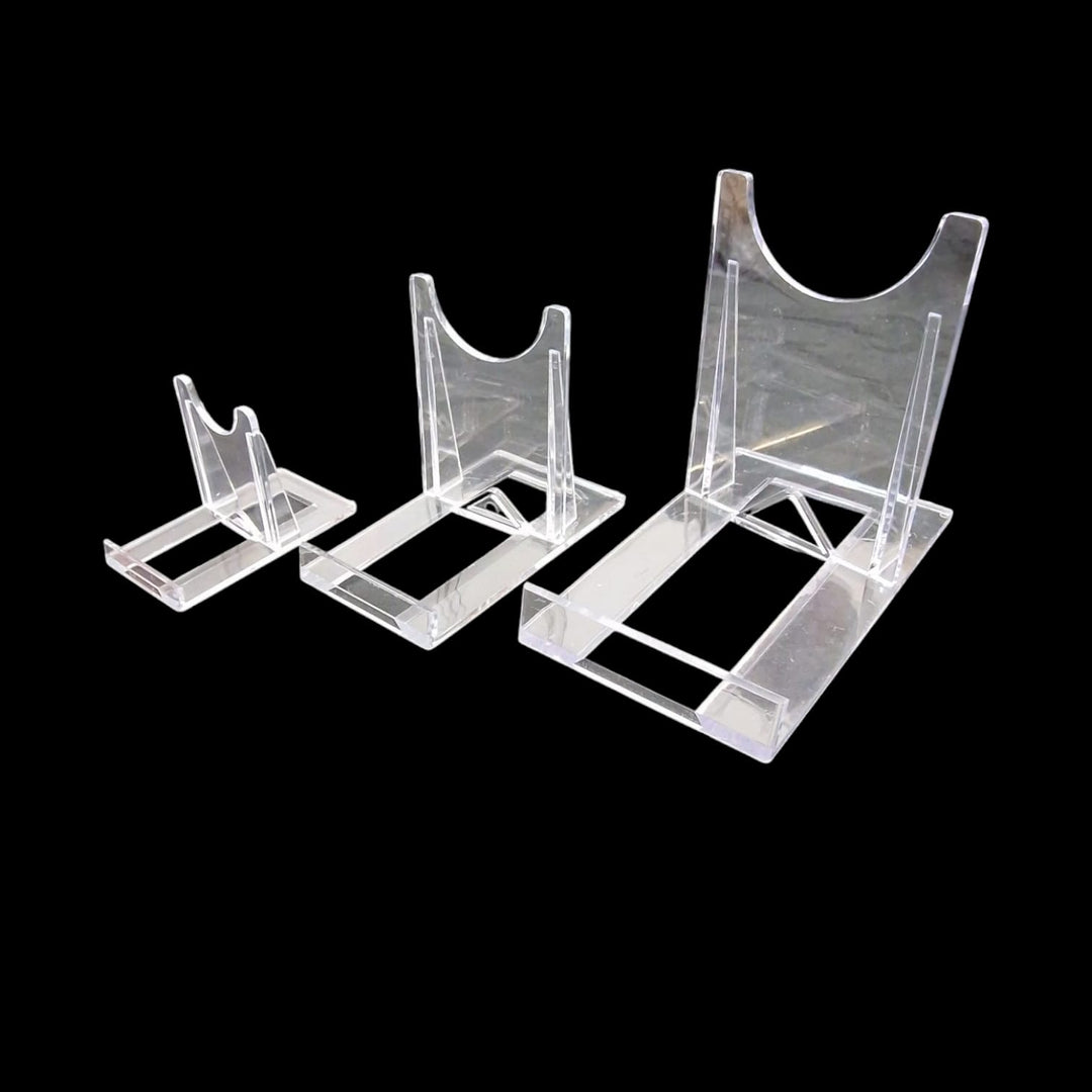 GeoFossils Grouped set of clear acrylic display stands in various sizes, designed for holding and showcasing crystals, minerals, spheres, or slabs in a professional and minimal style.