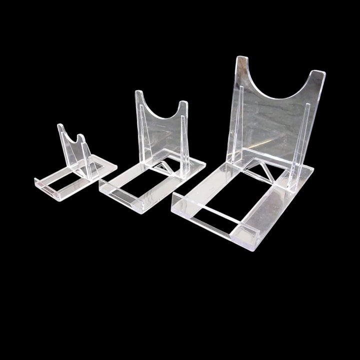 GeoFossils Grouped set of clear acrylic display stands in various sizes, designed for holding and showcasing crystals, minerals, spheres, or slabs in a professional and minimal style.