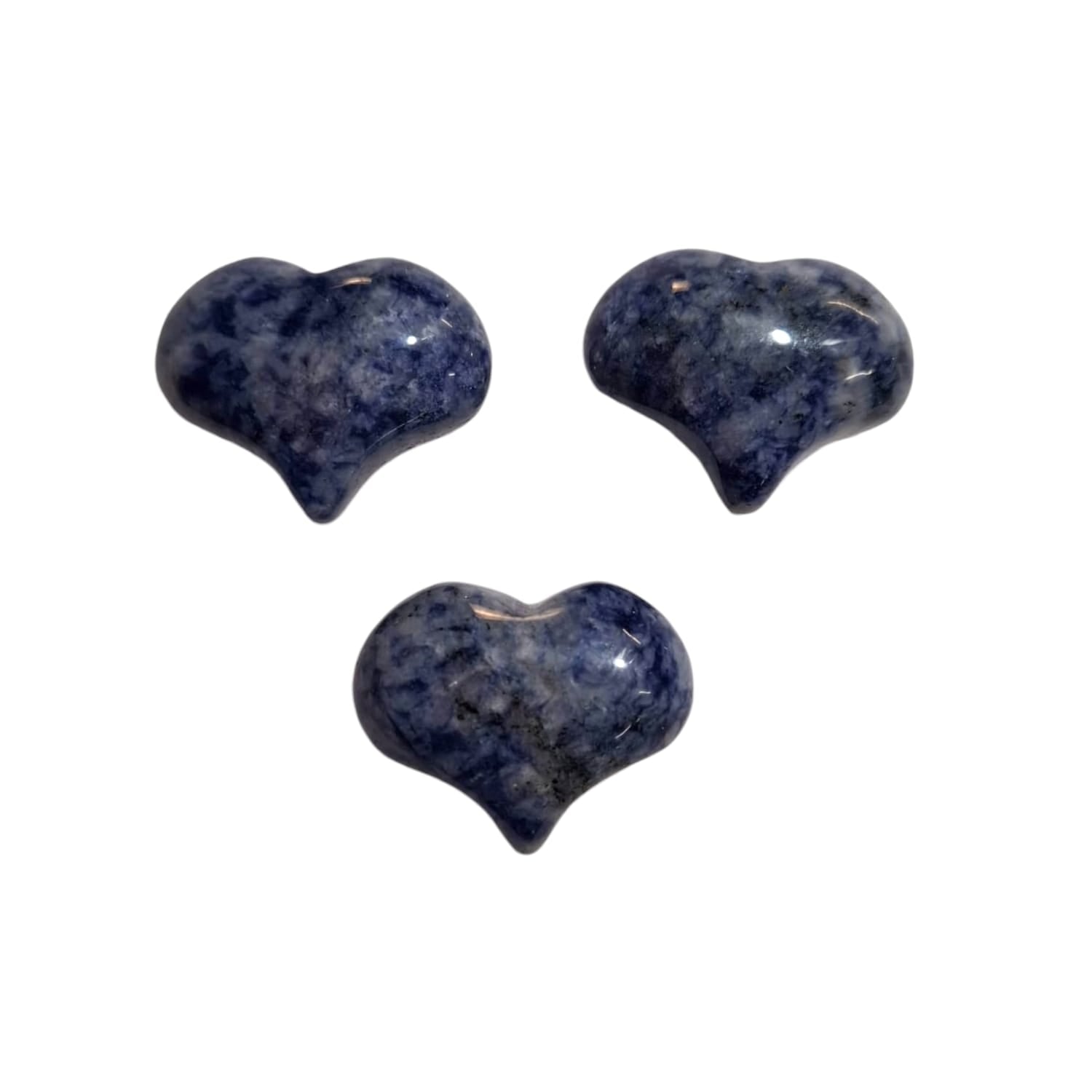 A small, polished puff heart made by GeoFossils from sodalite, featuring deep blue tones with natural white streaks and veins. The heart has a smooth, rounded shape, highlighting the stone’s distinctive patterns and calming colour palette. The rich, marbled appearance of the sodalite heart evokes a sense of tranquillity, clarity, and connection to the sky.