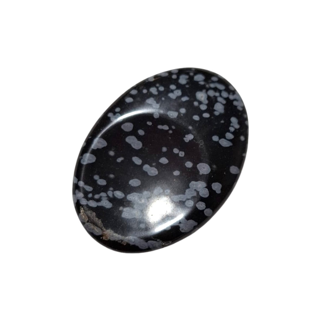 GeoFossils Snowflake Obsidian Thumbstone – black volcanic glass with grey snowflake patterns for grounding, clarity, and protection – smooth polished worry stone.
