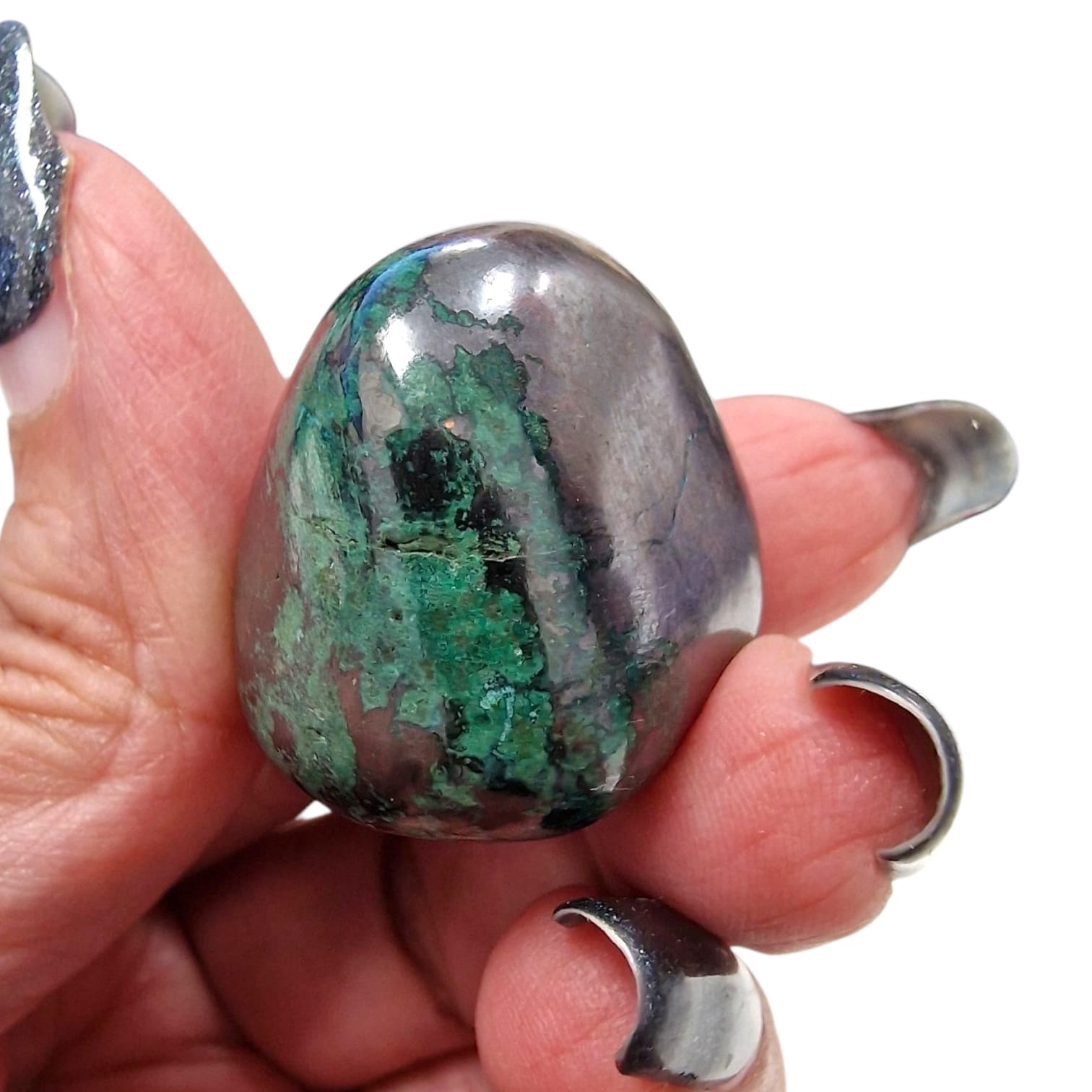 GeoFossils Cuprite Tumble Stone with Malachite inclusions, a rare red and green crystal for grounding, courage, and emotional healing.