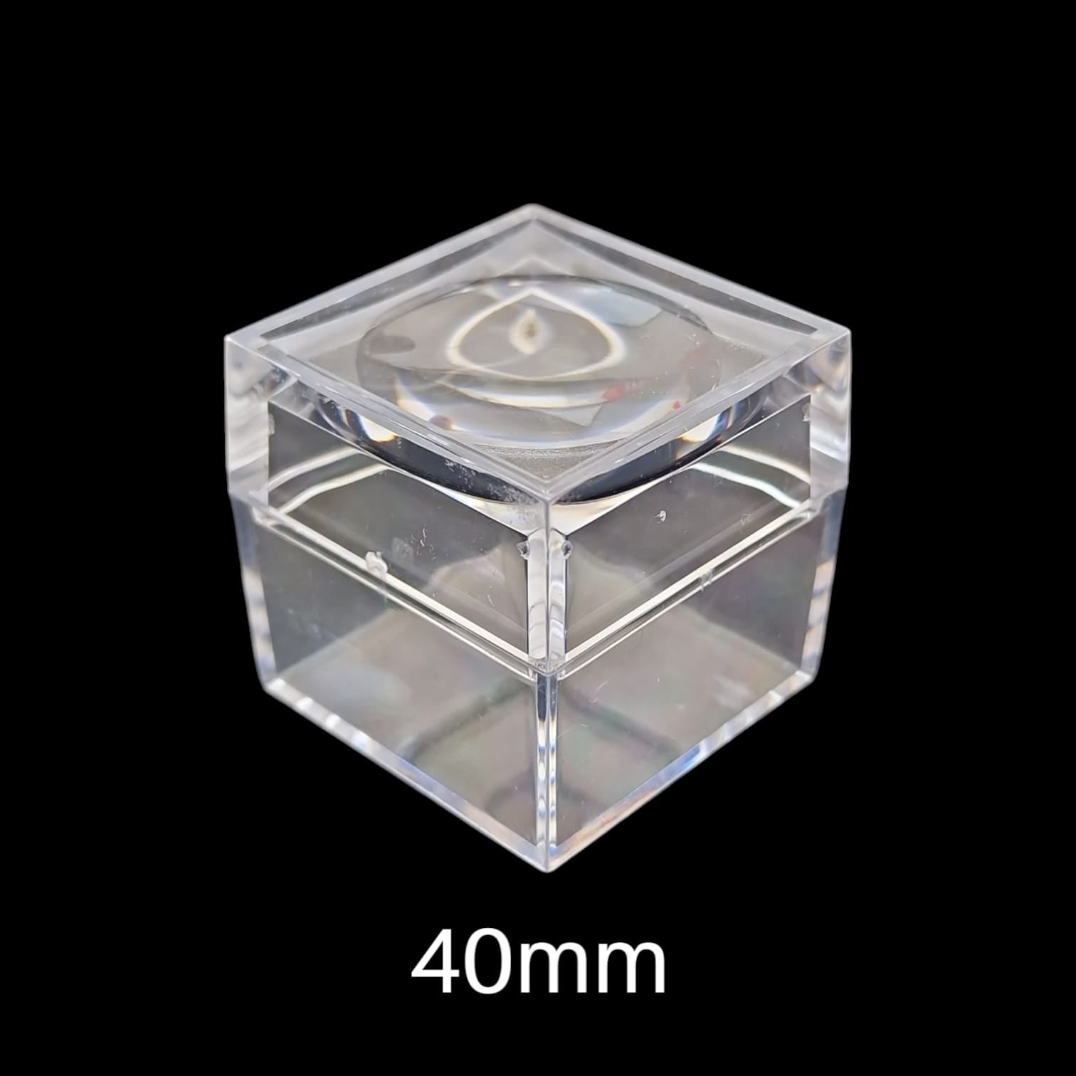 GeoFossils 40mm clear mineral display box with built-in magnifying lid, designed for viewing and storing small crystal or mineral specimens with enhanced detail.