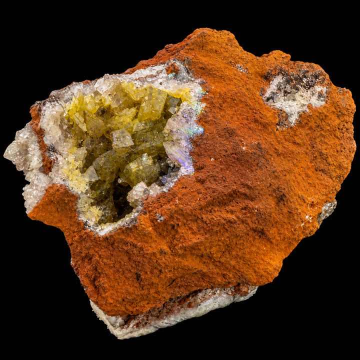 GeoFossils Adamite specimen 194 under Mid Wave UV, with subtle fluorescence visible around the crystal-lined cavity and surrounding mineral areas.
