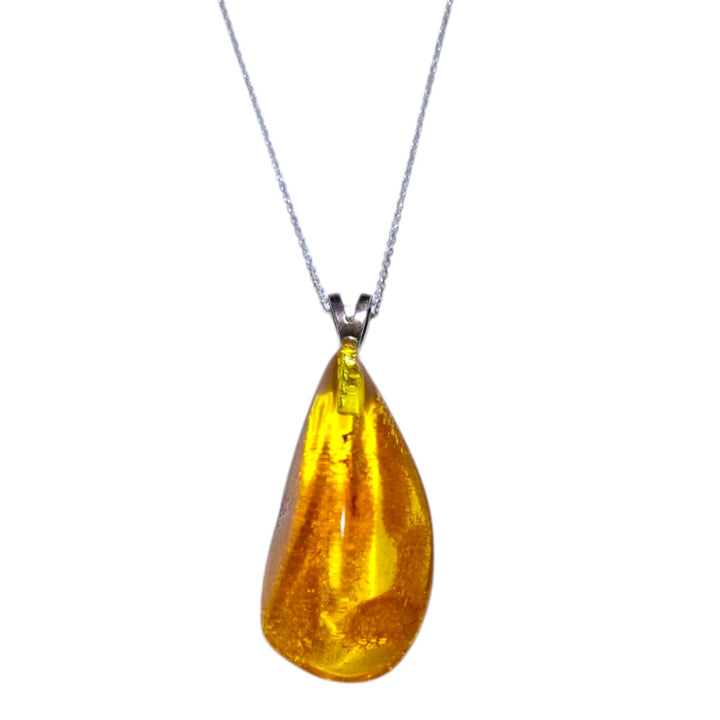 Amber crystal pendant with golden fossilised resin, set in hallmarked sterling silver – warming crystal for vitality and balance with optional chain.