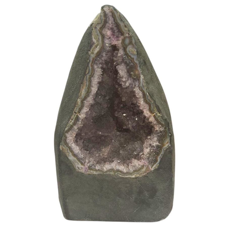 Amethyst geode with internal crystal formation resembling a meditating figure, deep purple crystal points, 2.41kg, perfect for spiritual and calming spaces.