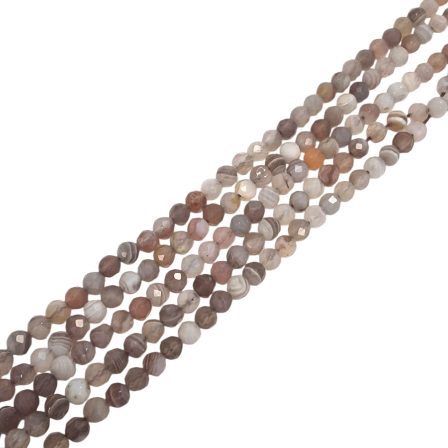 Botswana Agate 4mm faceted round beads on a white background