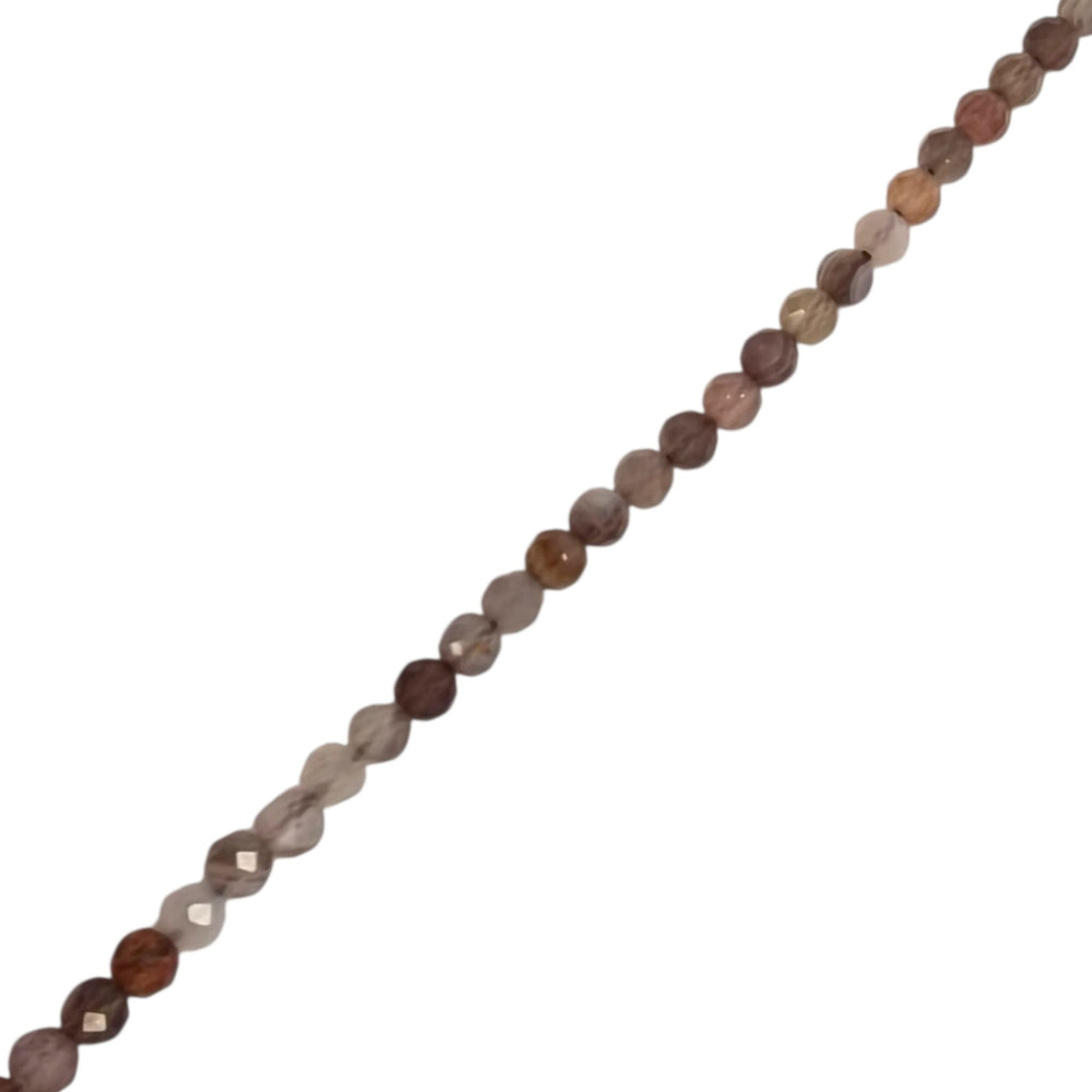 Close-up of Botswana Agate 4mm faceted round beads showing natural banding and detail