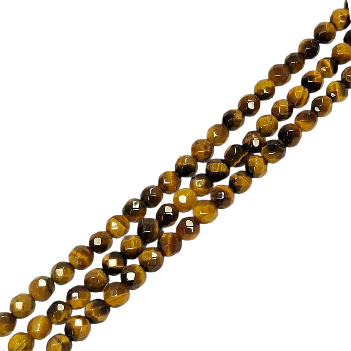 Gold Tigers Eye 4mm faceted round beads on a white background