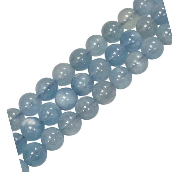 Close-up of Kunzite round beads showing natural colour and texture