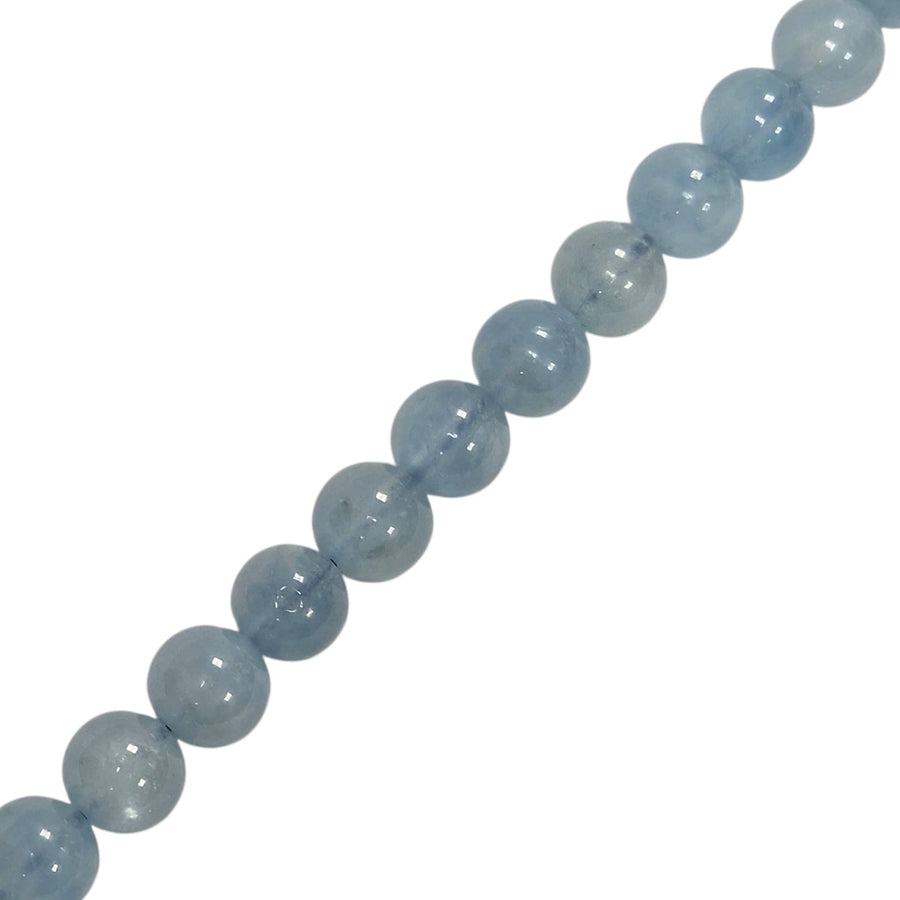 Close-up of Kunzite round beads showing natural colour and texture