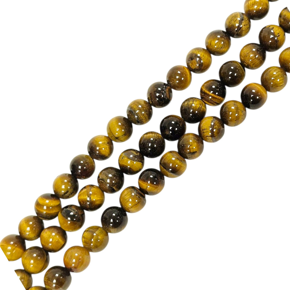 Close-up of Gold Tigers Eye round beads showing chatoyancy