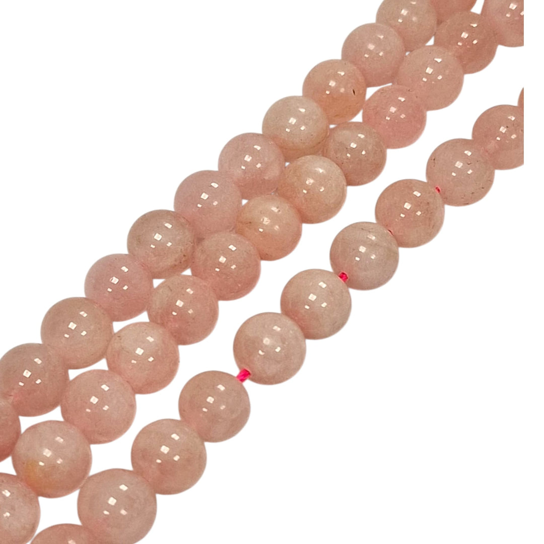 Close-up of Morganite round beads showing natural colour variation
