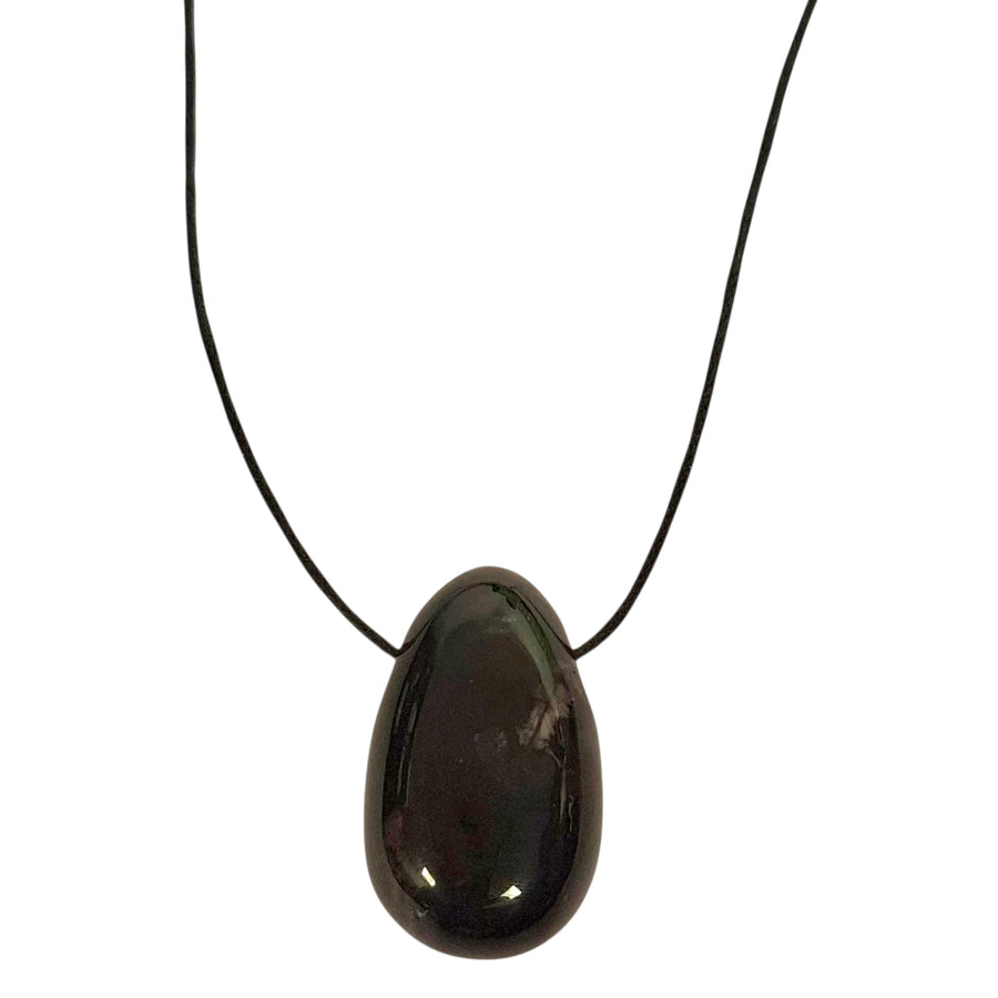 Black Tourmaline drilled tumble stone pendant on a black cord – grounding and protective black crystal for energy shielding and emotional strength