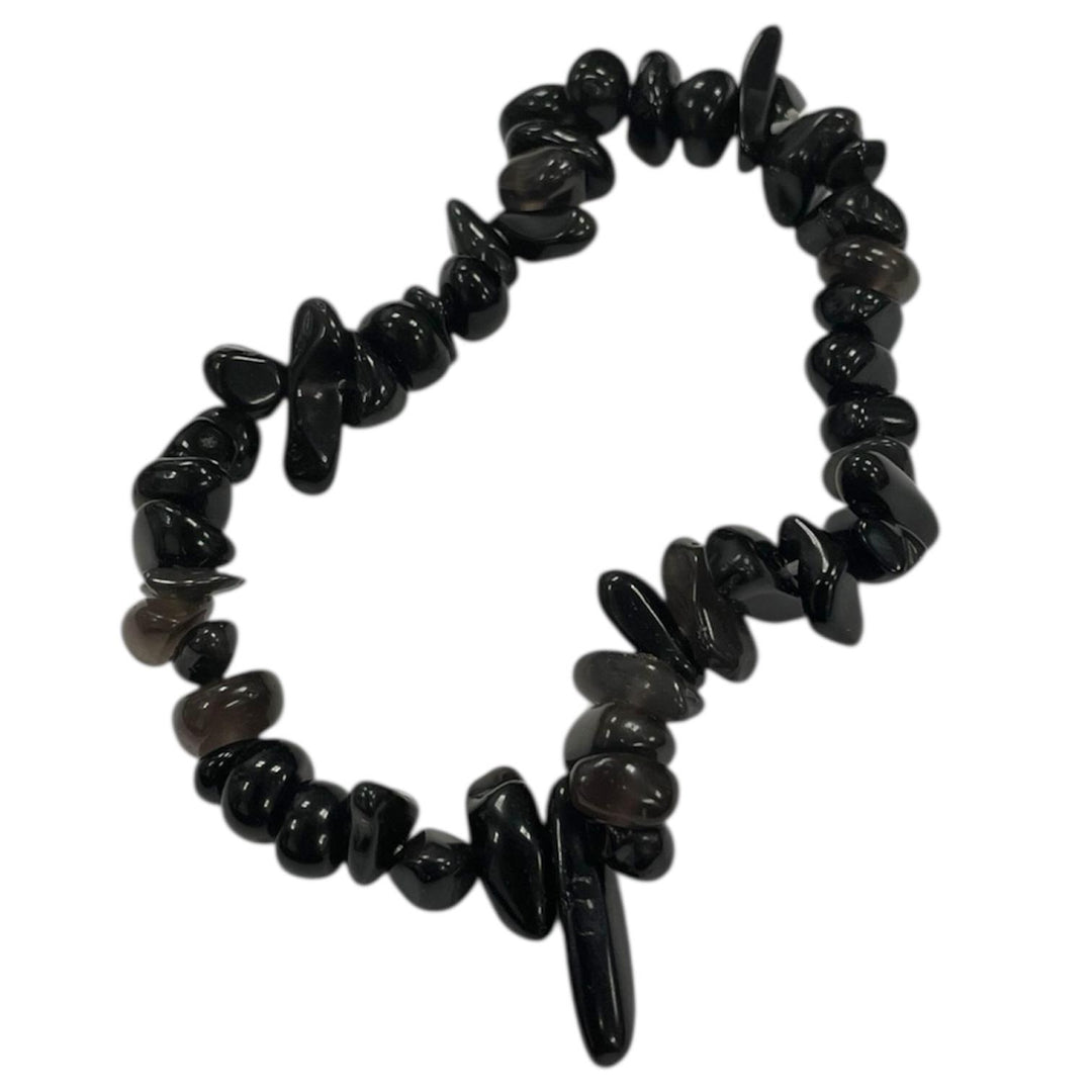 GeoFossils Black Obsidian gem chip bracelet with glossy, irregular chips strung on elastic, used for protection, grounding, and energy shielding in crystal healing.