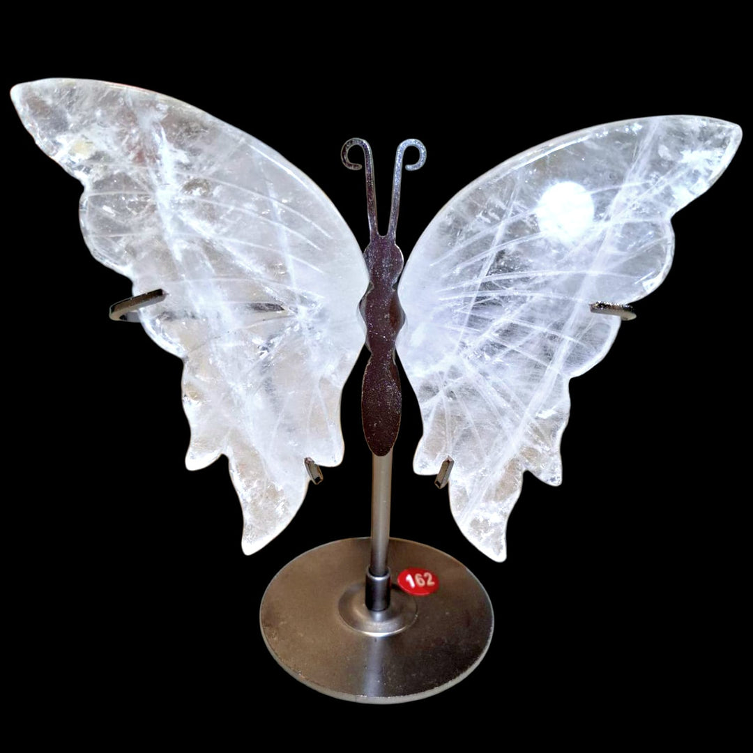Crystal Quartz butterfly carving mounted on metal stand, symbolising transformation, clarity, and spiritual elevation