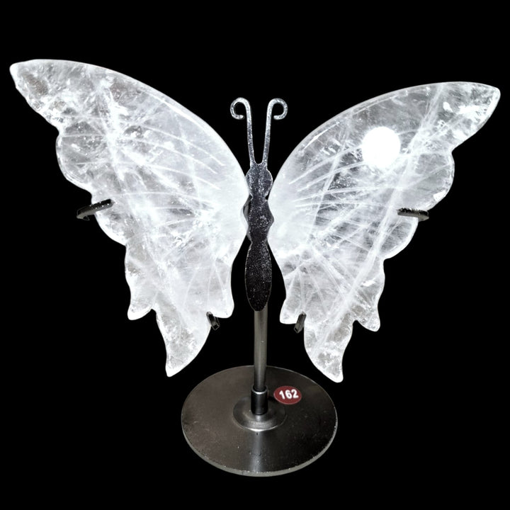 Crystal Quartz butterfly carving mounted on metal stand, symbolising transformation, clarity, and spiritual elevation