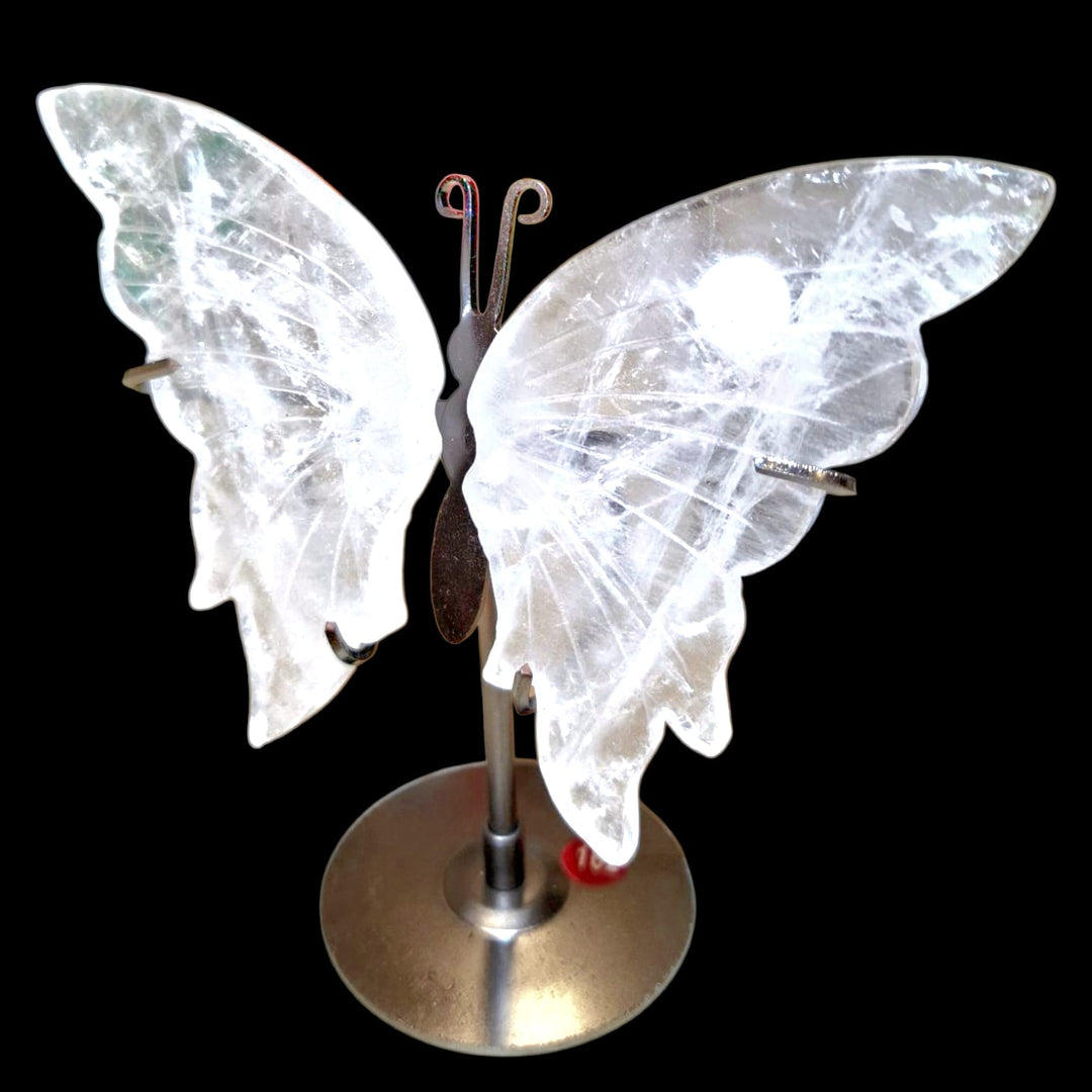 Crystal Quartz butterfly carving mounted on metal stand, symbolising transformation, clarity, and spiritual elevation