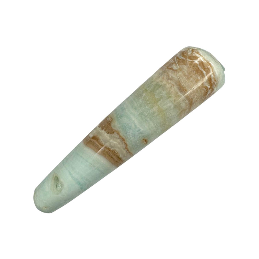 Polished Caribbean Calcite crystal massage wand featuring soothing layers of pale blue, white, and sandy brown tones, with a smooth cylindrical body and rounded ends, perfect for calming massage, inner peace, and third eye activation.