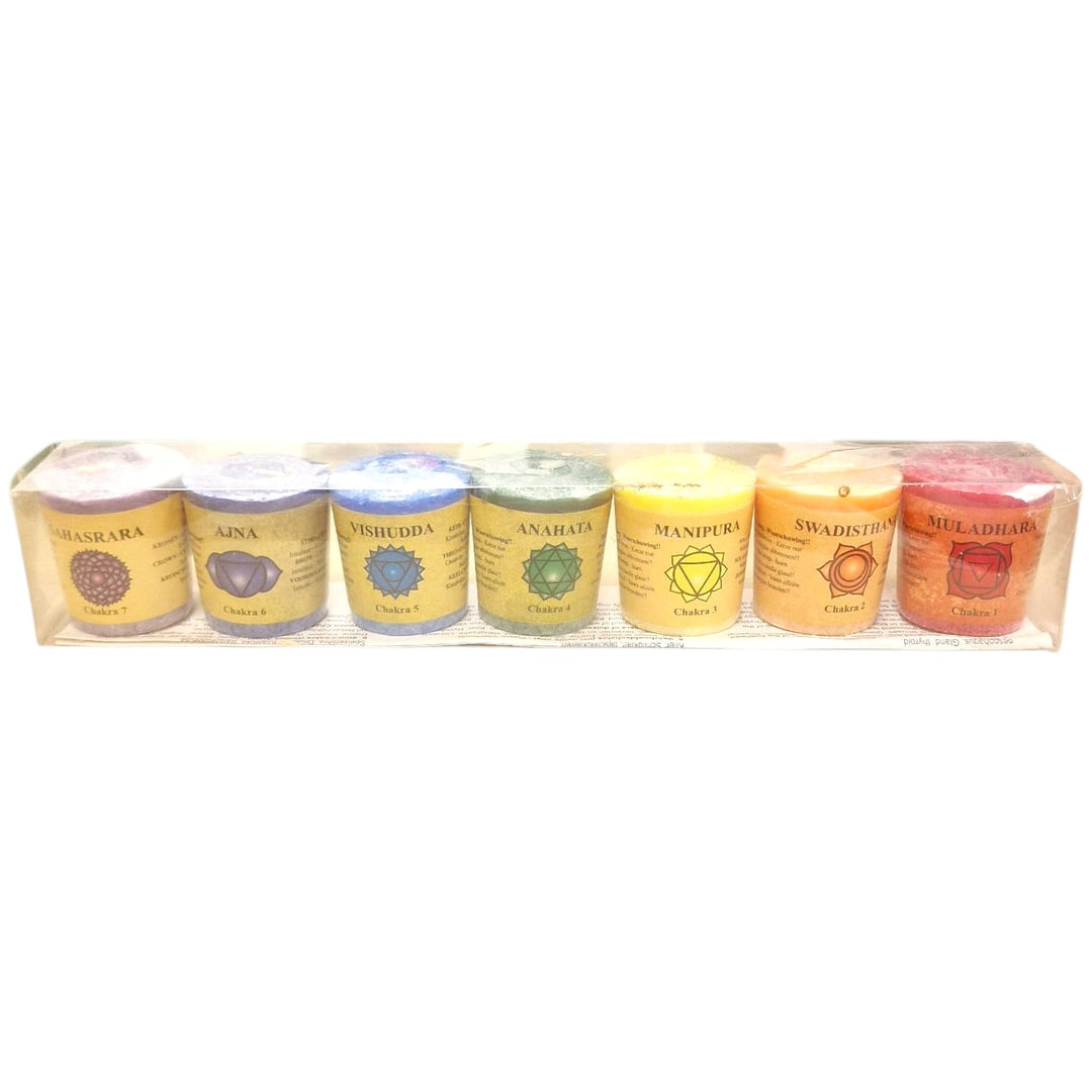 Set of seven chakra candles in different colours and scents for spiritual balance, meditation, and energy healing