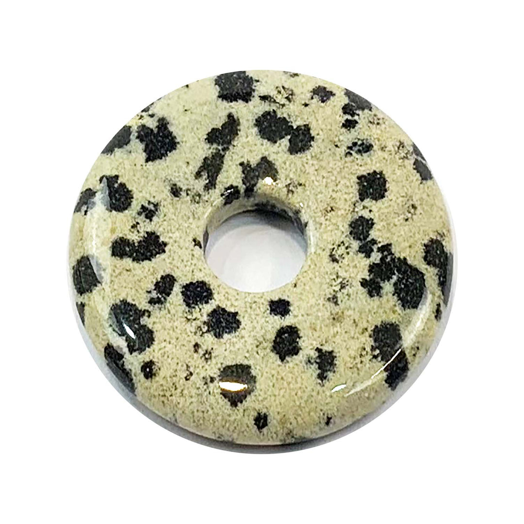 Dalmatian Stone Munay Ki Pi Donut by GeoFossils – smooth, black and white spotted circular stone, perfect for grounding, protection, and connecting with the Root Chakra in Andean spiritual practice
