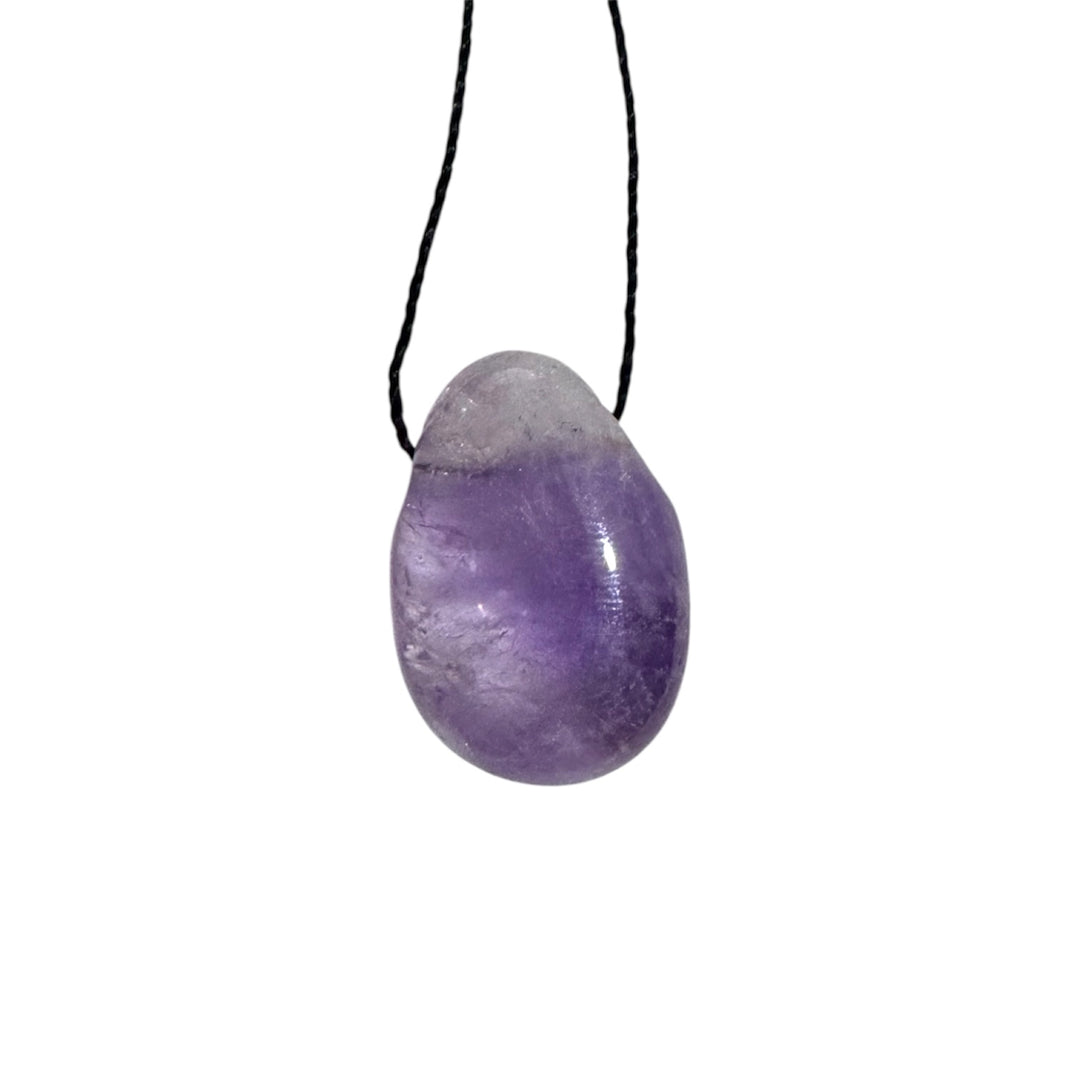 Polished Ametrine drilled tumblestone threaded with black cord, blending golden Citrine and purple Amethyst tones for balance and clarity