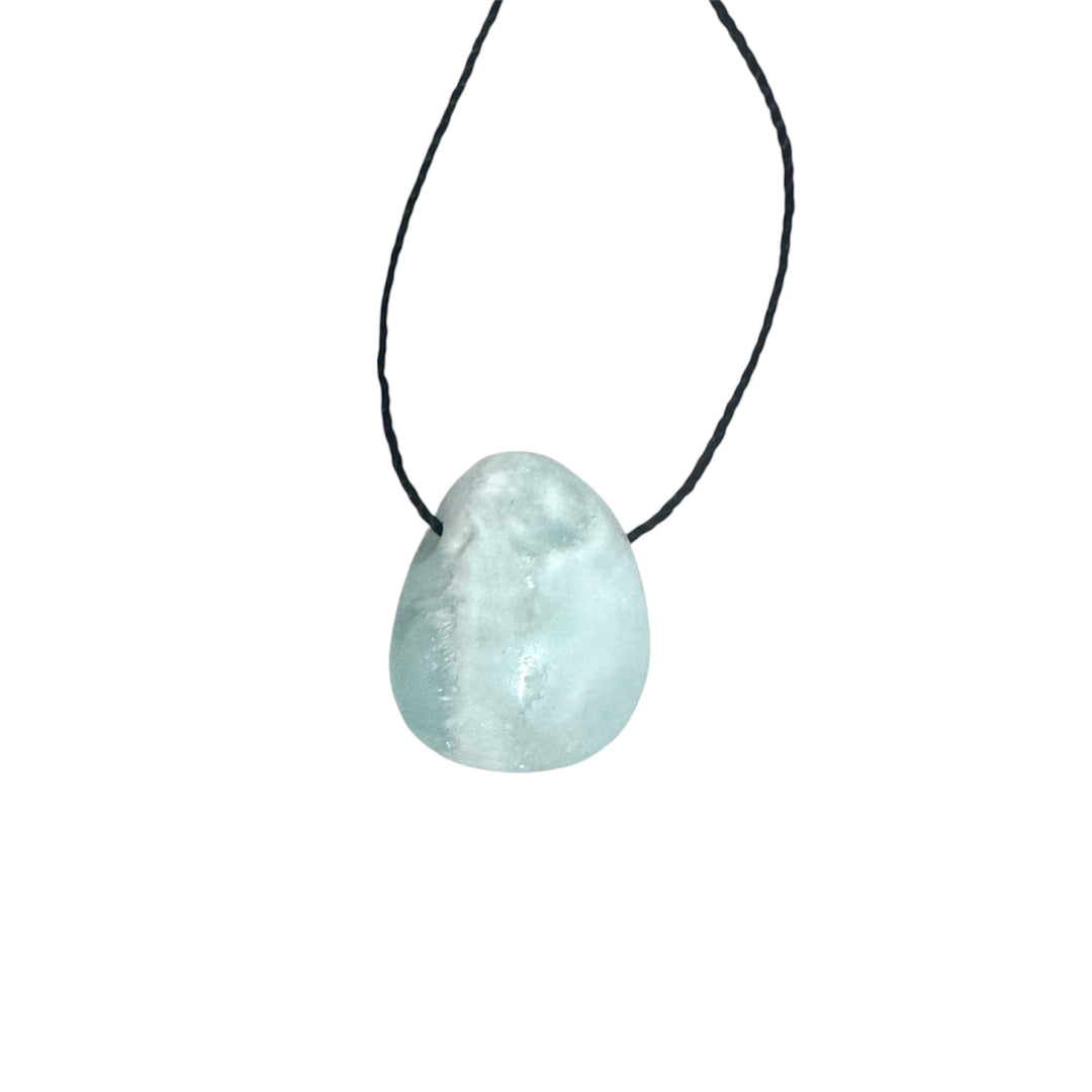 Polished Blue Aragonite drilled tumblestone on black cord, showcasing soft aqua-blue tones for emotional healing and soothing energy