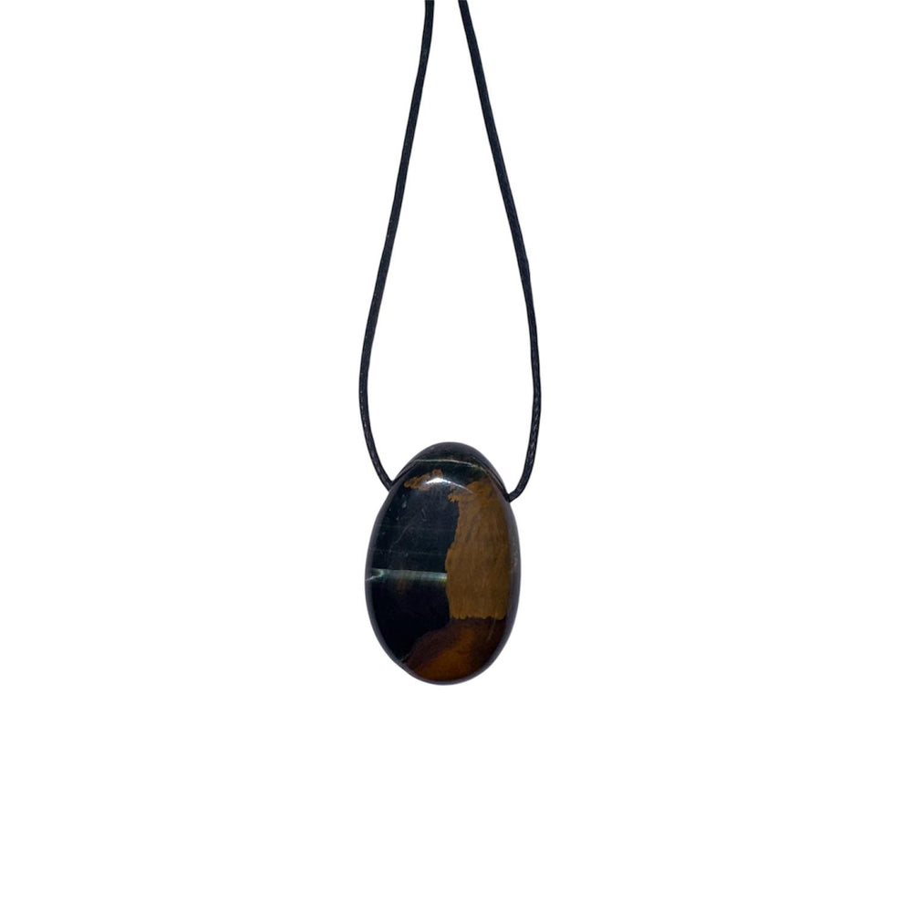 Polished Blue Tiger’s Eye pendant with deep midnight blue tones and silky chatoyancy, displayed on a black cotton cord.