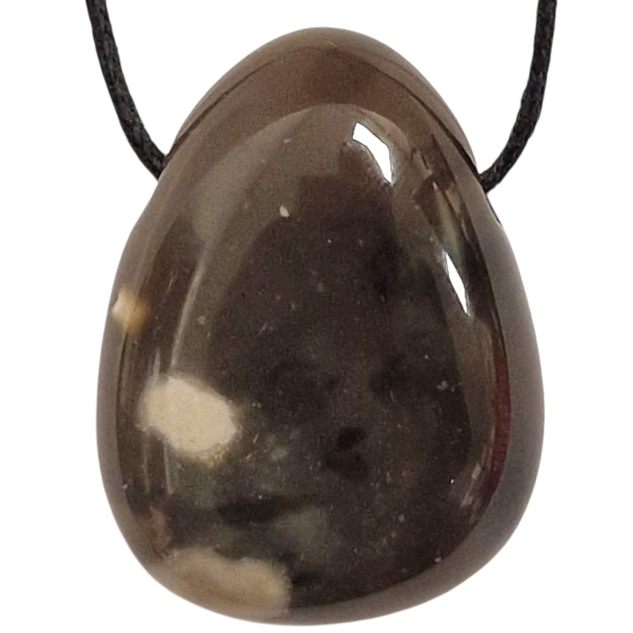 Polished Black Flint tumble stone pendant with dark charcoal tones and subtle natural banding, shown on a black cotton cord.