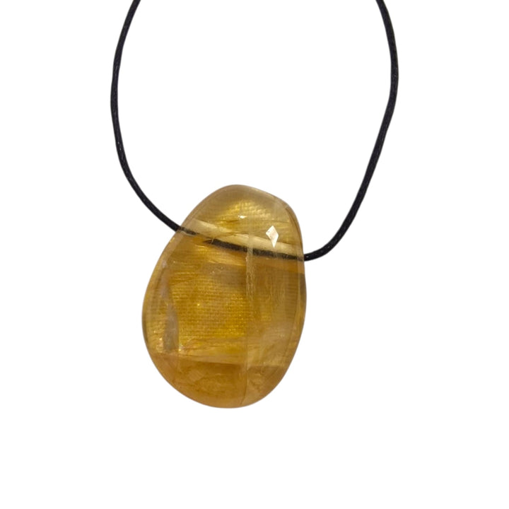 GeoFossils Honey Calcite drilled tumble stone on black cord with golden tones