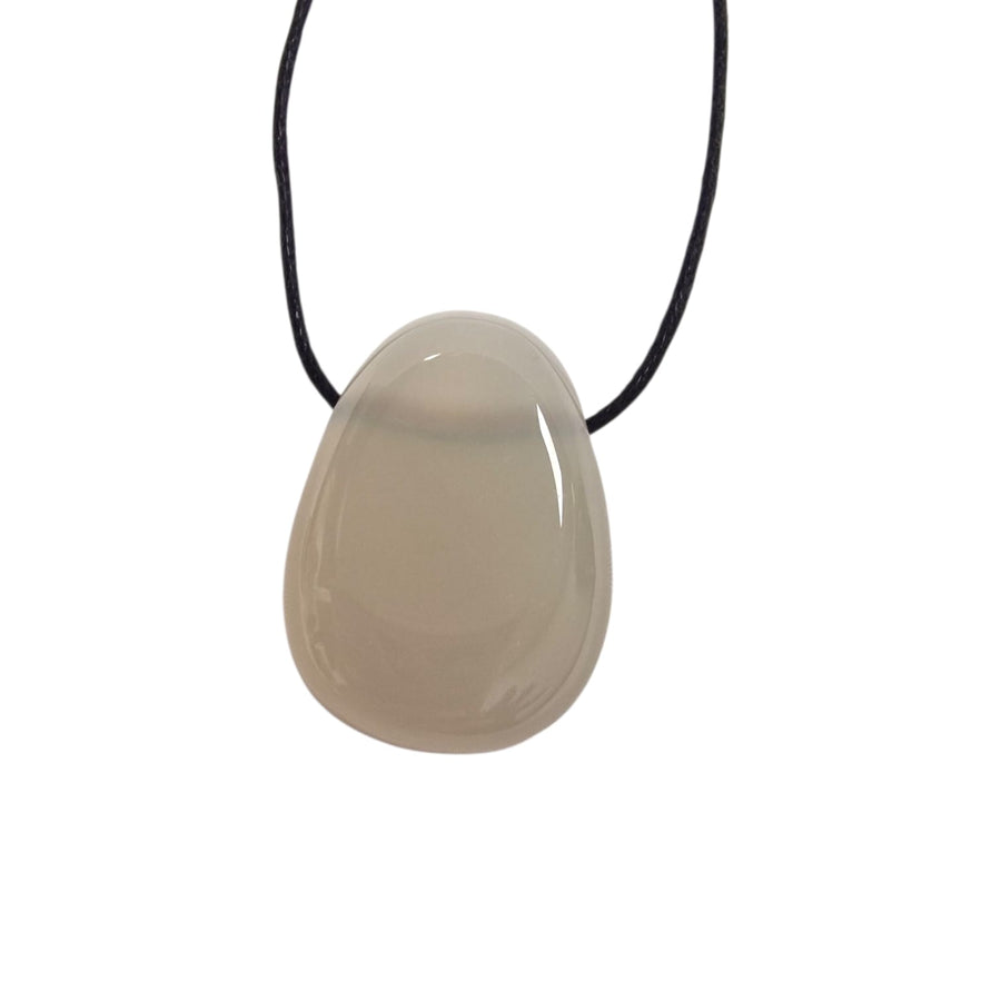 GeoFossils Pastel Moonstone pendant shown on black cotton cord, ready to wear