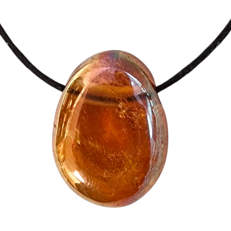 GeoFossils Drilled Sunset Aura Quartz – polished and drilled stone with shimmering sunset tones.
