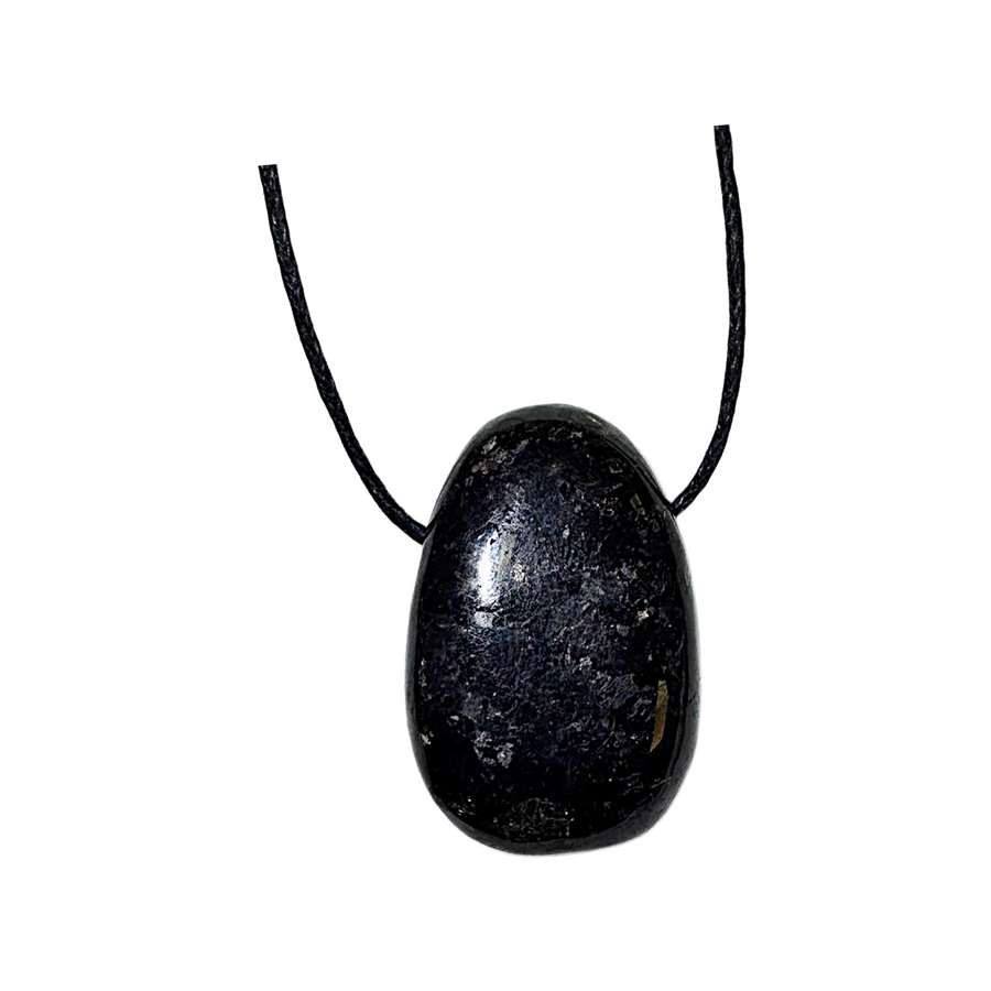 Side-drilled Nuumite tumble stone displayed on black vegan cotton cord. Known as the “Sorcerer’s Stone,” it offers deep protection, aura shielding, and assists with shadow work. A powerful ally for spiritual transformation and grounding.