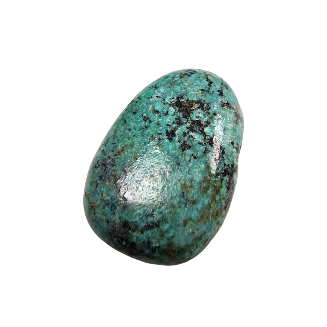 Group display of drilled African Turquoise tumble stones from our collection, featuring a mix of mottled greens, browns, and black veining.
