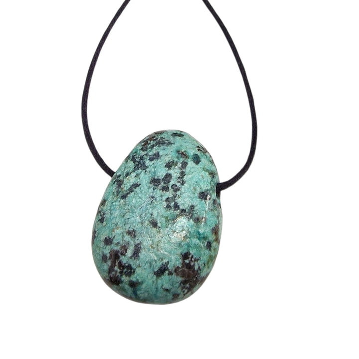 Drilled African Turquoise tumble stone in mottled green tones, suspended on a black cord, showcasing natural patterning and polished finish.