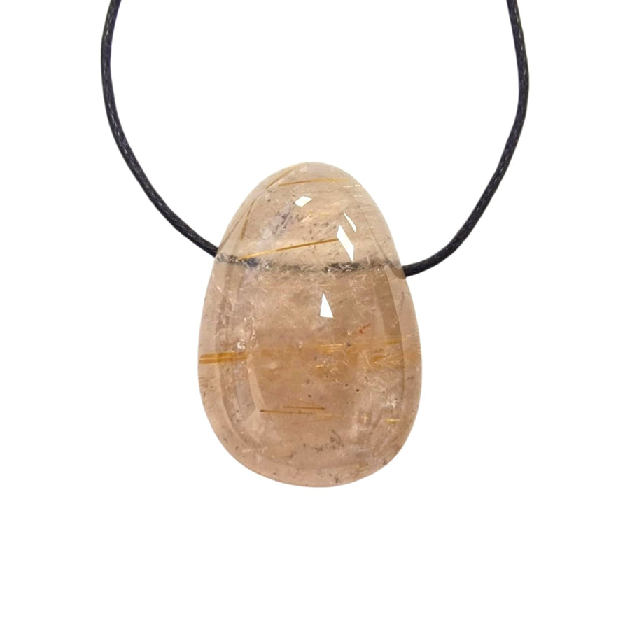 GeoFossils Clear Rutilated Quartz tumble stone pendant with fine golden needle-like inclusions, shown on a black cotton cord.