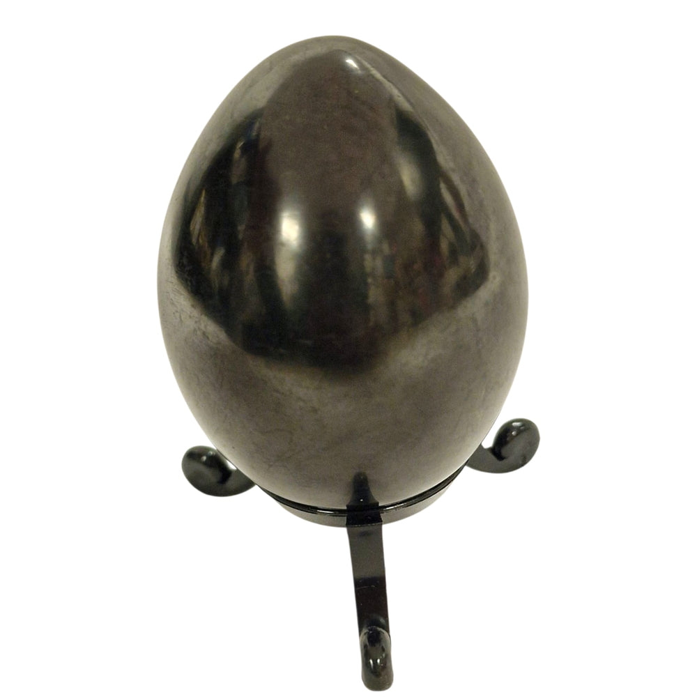 60mm Shungite egg on white background, smooth crystal symbolising creation and balance