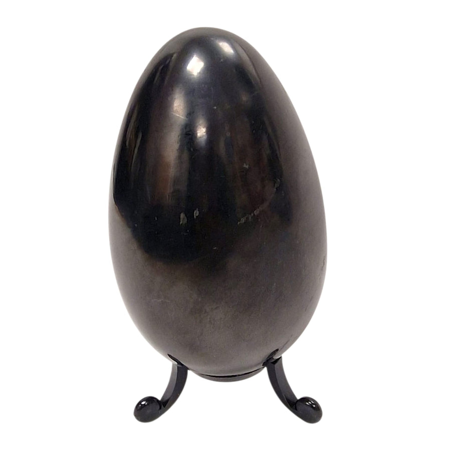 100mm Shungite egg on white background, smooth crystal symbolising renewal and balance